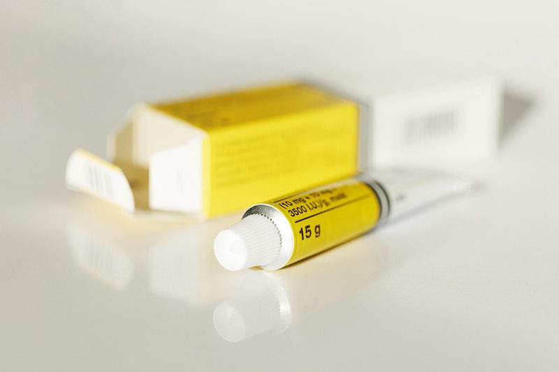 topical medical pain reliever agent in a yellow tube