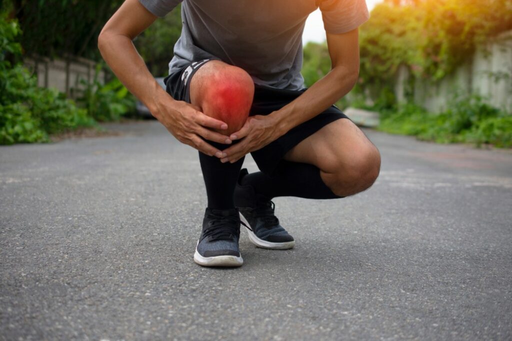 A man experiencing sharp knee pain