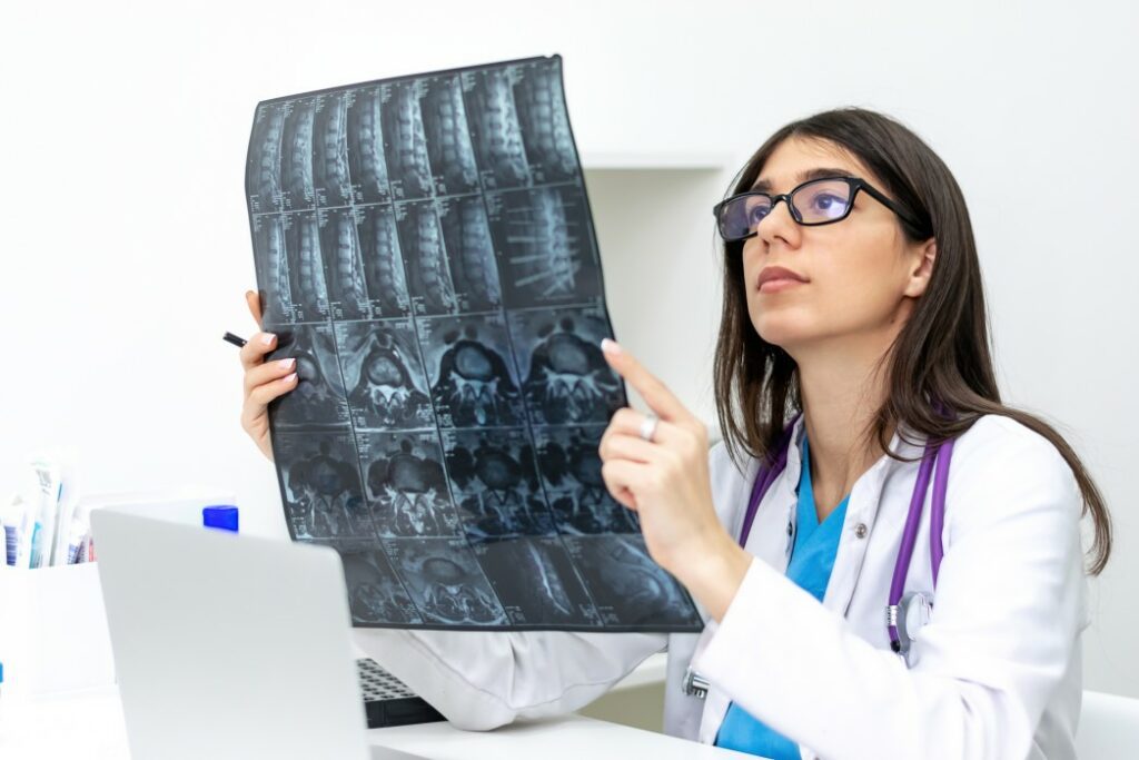 A doctor examining MRI scans
