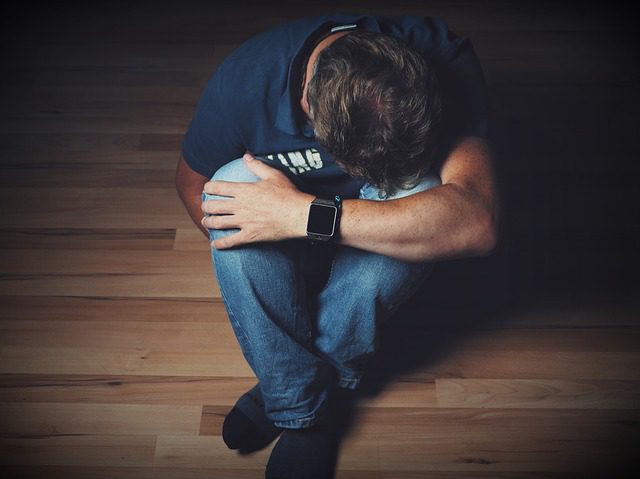 An image showing a man with depression