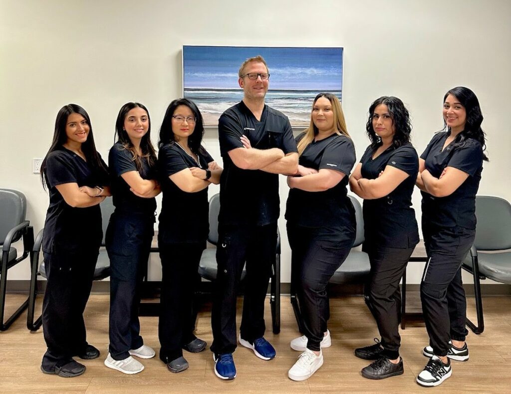 Atlas Pain Management Team in black scrubs uniform